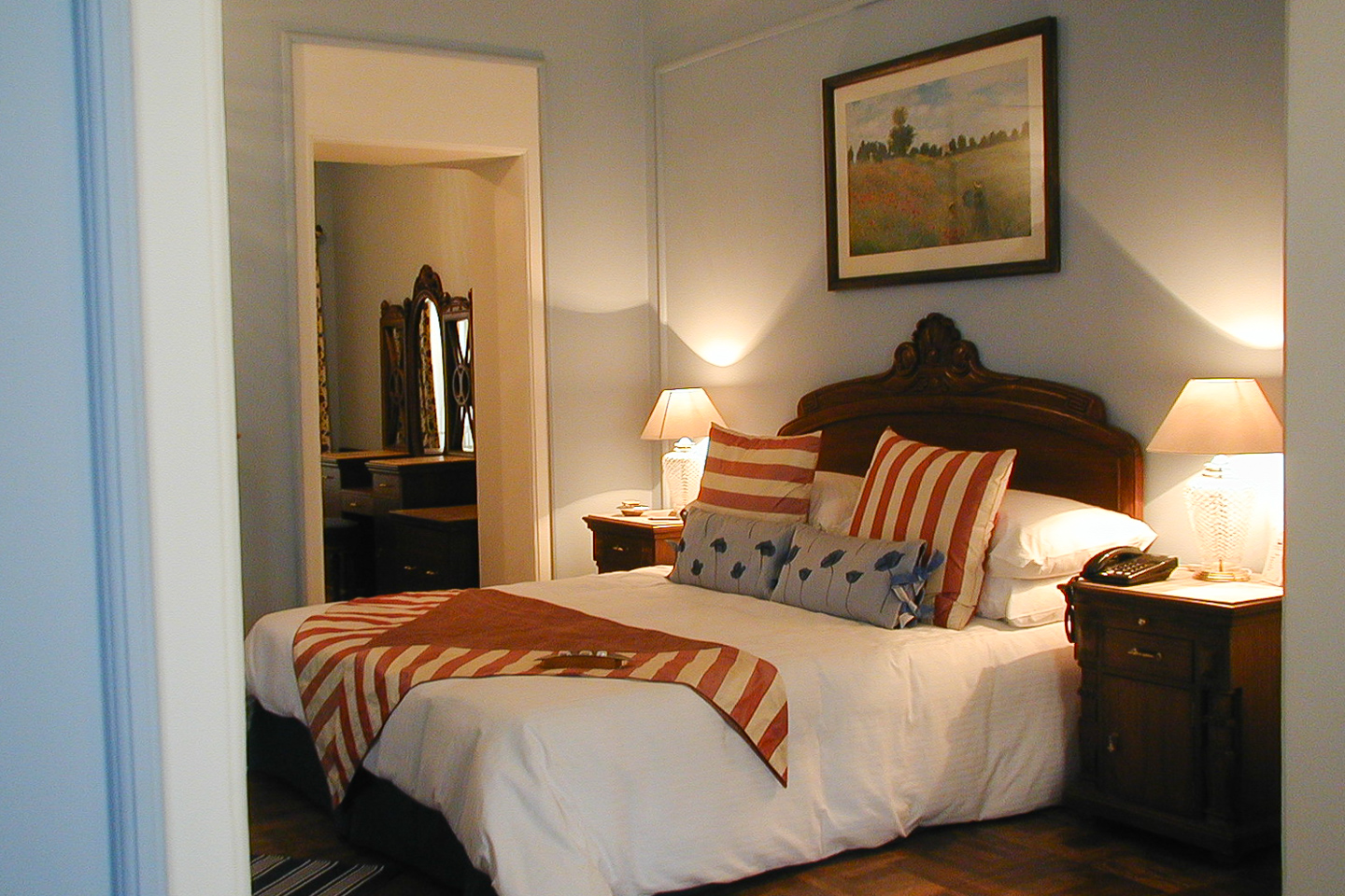 The blue guest room has pale blue walls with white highlights.
