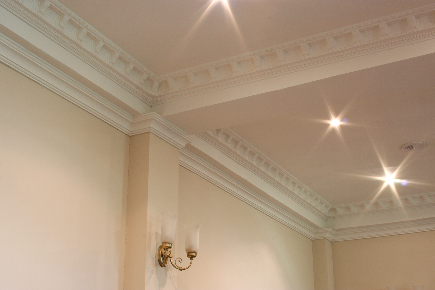 All new pilasters, beams and mouldings in the conference room.